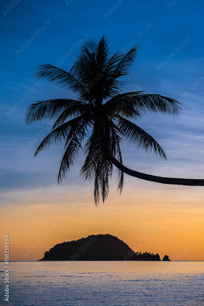 Beautiful tropical island beach in sunset evening - Travel summer holiday vacation concept.