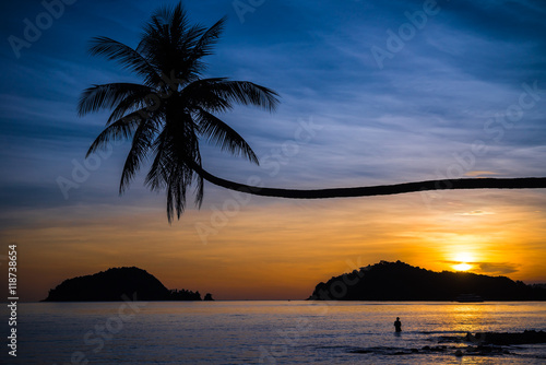 Fototapeta Naklejka Na Ścianę i Meble -  Beautiful tropical island beach in sunset evening - Travel summer holiday vacation concept.