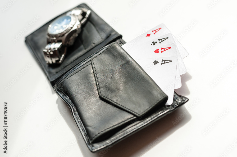 Gambler's wallet with four of a kind Gambler's wallet with four of a kind