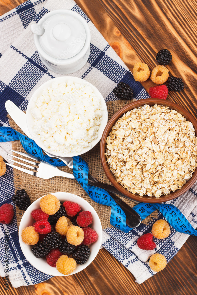 Portion of oatmeal in the bowl with different berries Portion of oatmeal in the bowl with different berries