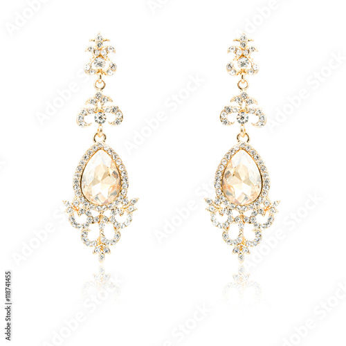Pair of golden diamond earrings isolated on white