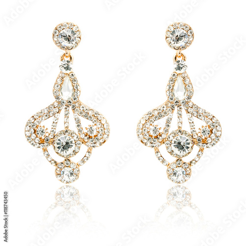 Pair of golden diamond earrings isolated on white