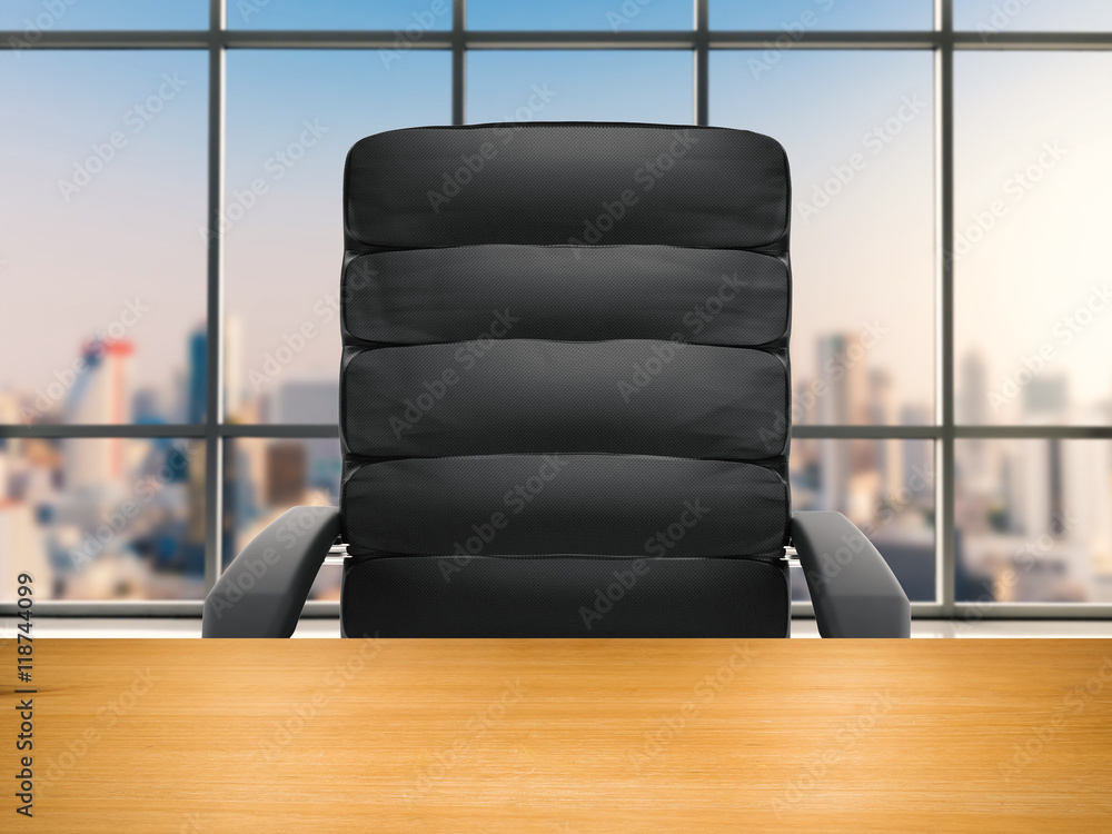 wooden table with office chair on office building background Stock