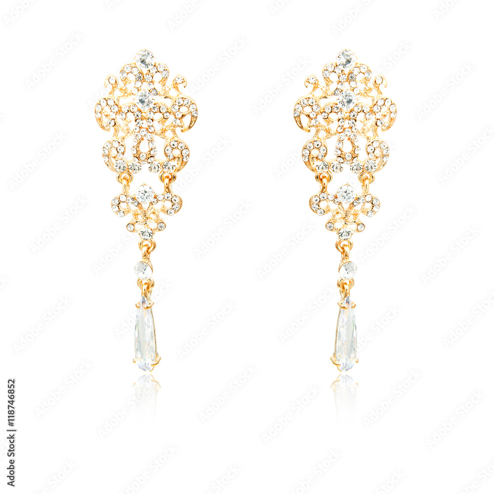 Pair of golden diamond earrings isolated on white Pair of golden diamond earrings isolated on white