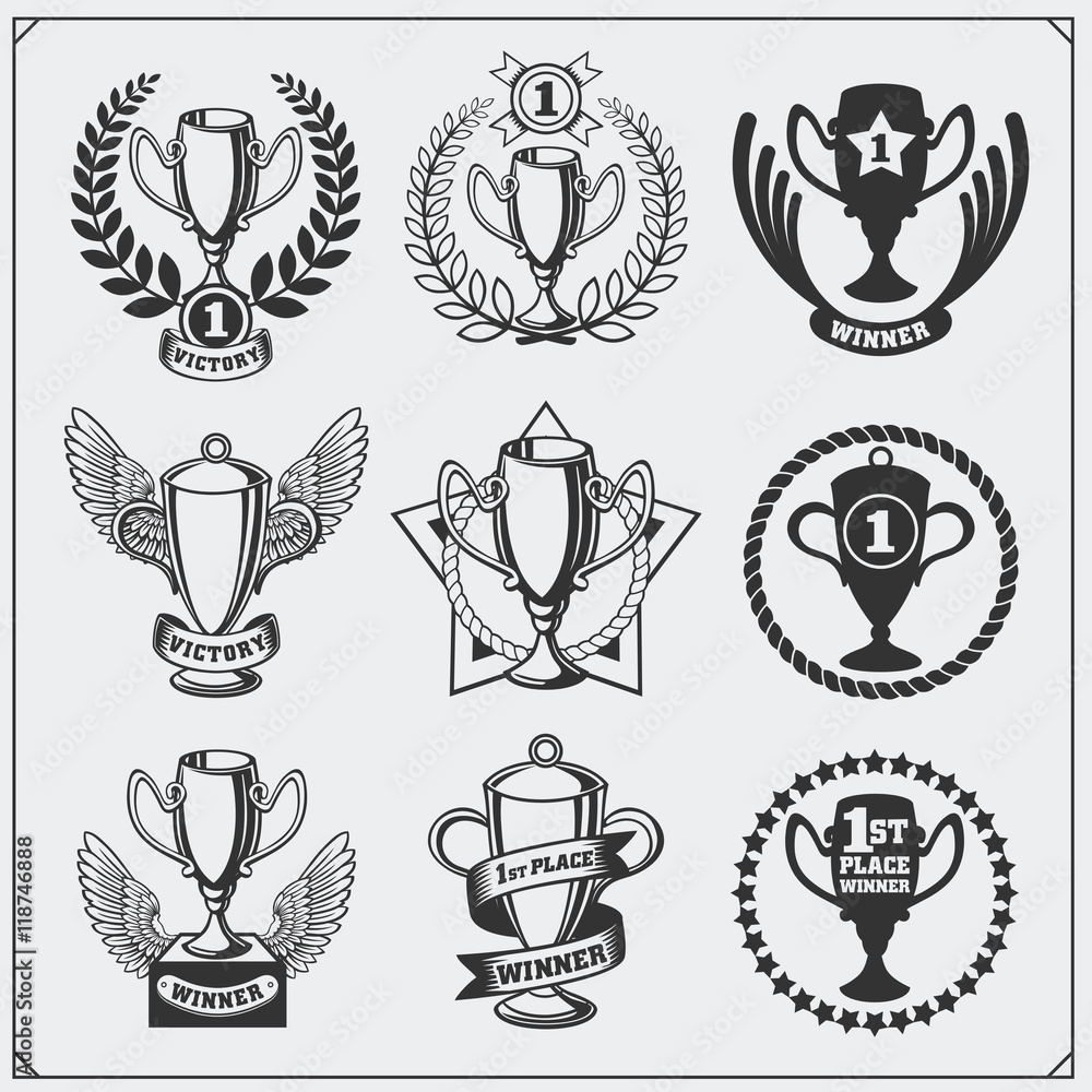 Set of sport awards and trophies. Winner cups with winner's wreath and award ribbon. Set of sport awards and trophies. Winner cups with winner's wreath and award ribbon.