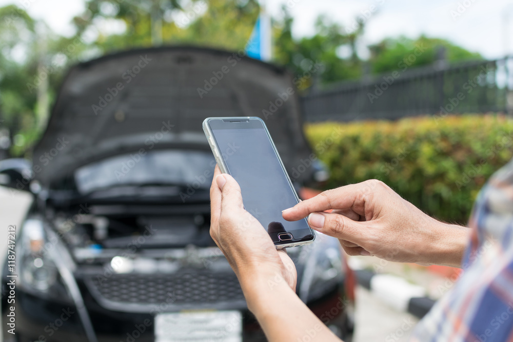 Man Phoning For Help with a broken down car