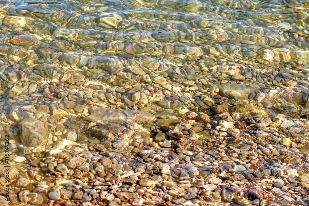 Pebble stones under sea water