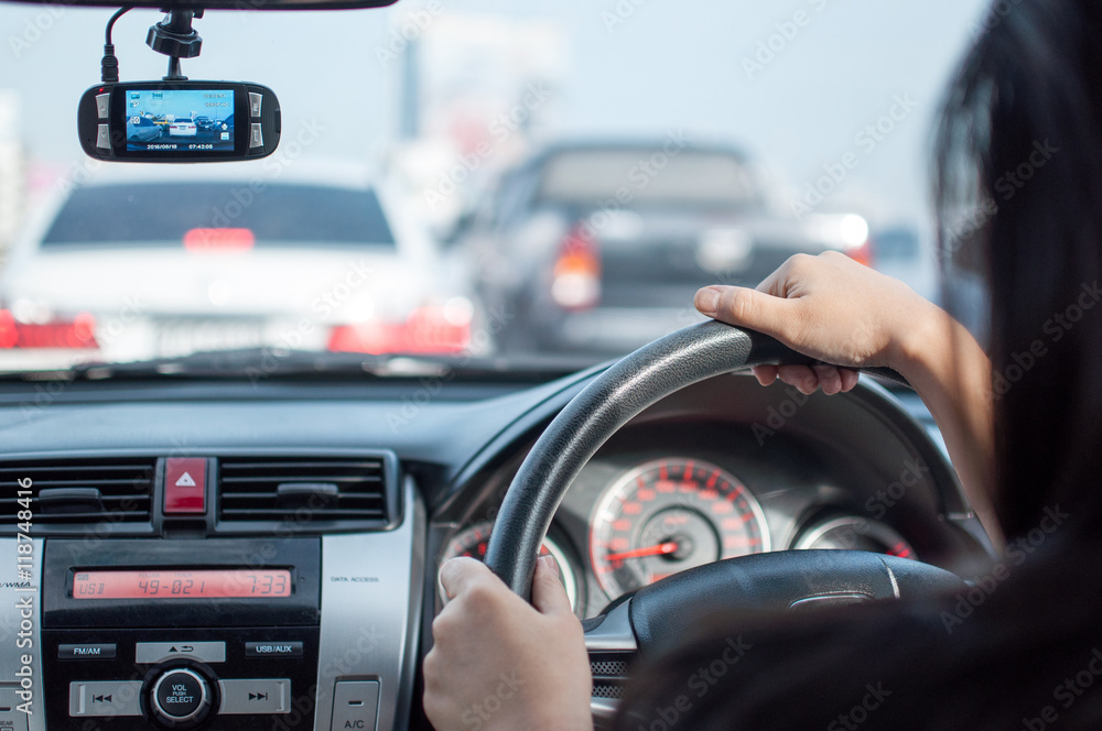Woman driving car,hand hold steering wheel