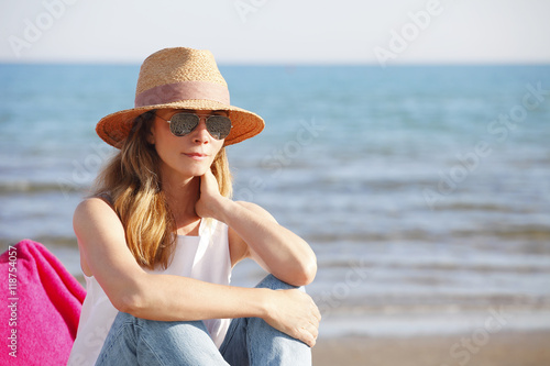 Perfect summer day. Beautiful woman on the beach.