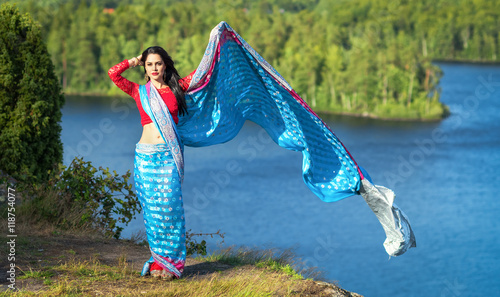 Brunette woman outdoor portrait in sari traditional skarf photo