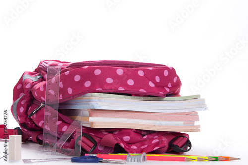 Slika na platnu Purple backpack with school supplies isolated on white backgroun