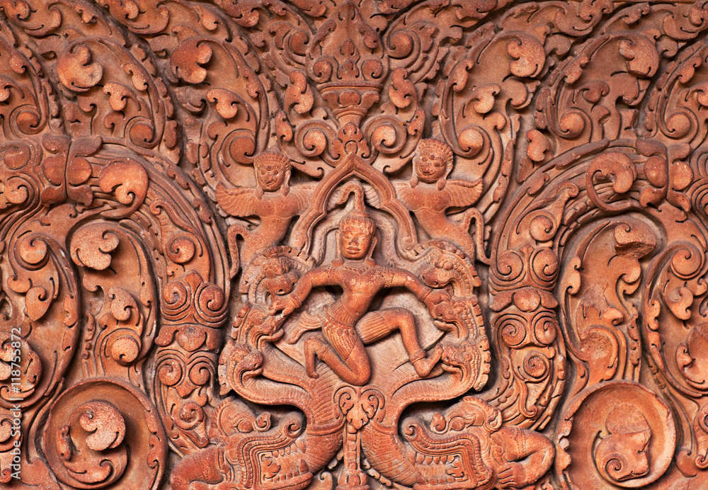 Ancient bas-relief at the temple wall in Angkor Wat, Cambodia.