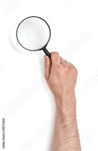 Hand of man holding the magnifying glass isolated on white background