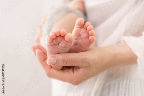 baby feet in mother hands 