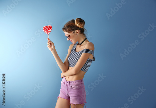 Beautiful girl with candy o...