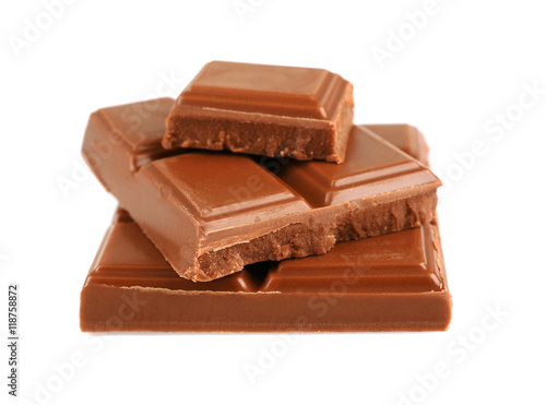 Pile of milk chocolate tiles isolated on white