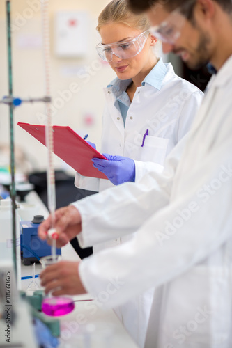 Chemist worker measure liquid in lab