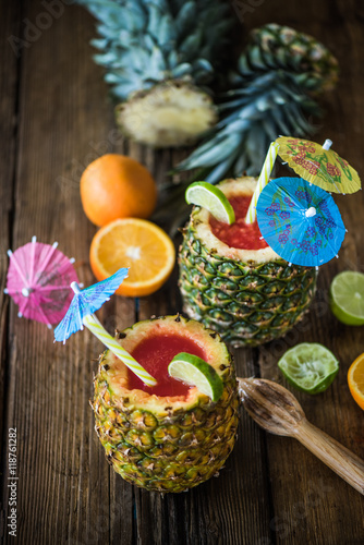 tropical juice in pineapple for summer party