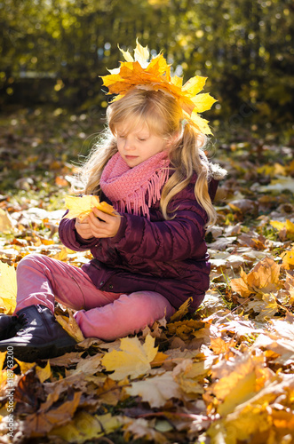 happy girl in autumn leaves