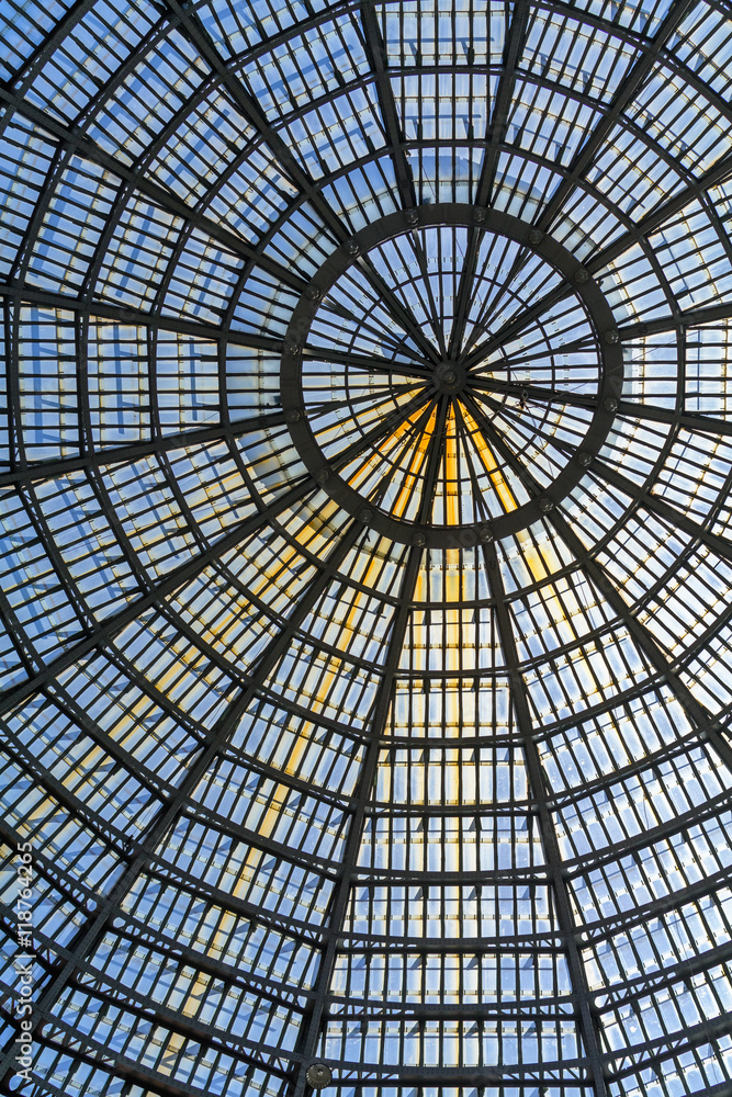 Multiple glass windows as part of domed ceiling. Vertical format
