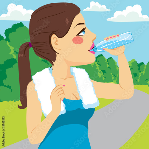 Young runner woman drinking...