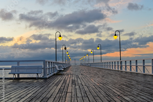 Beautiful wooden pier at sunrise © Nadiyka