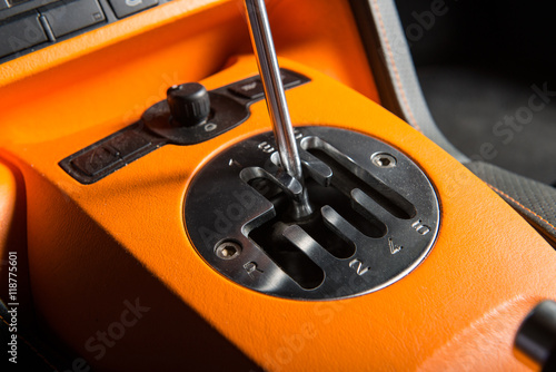 Close up of manual gearsift transmission of a sportive car. photo