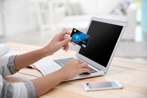 Woman hands using credit ca...