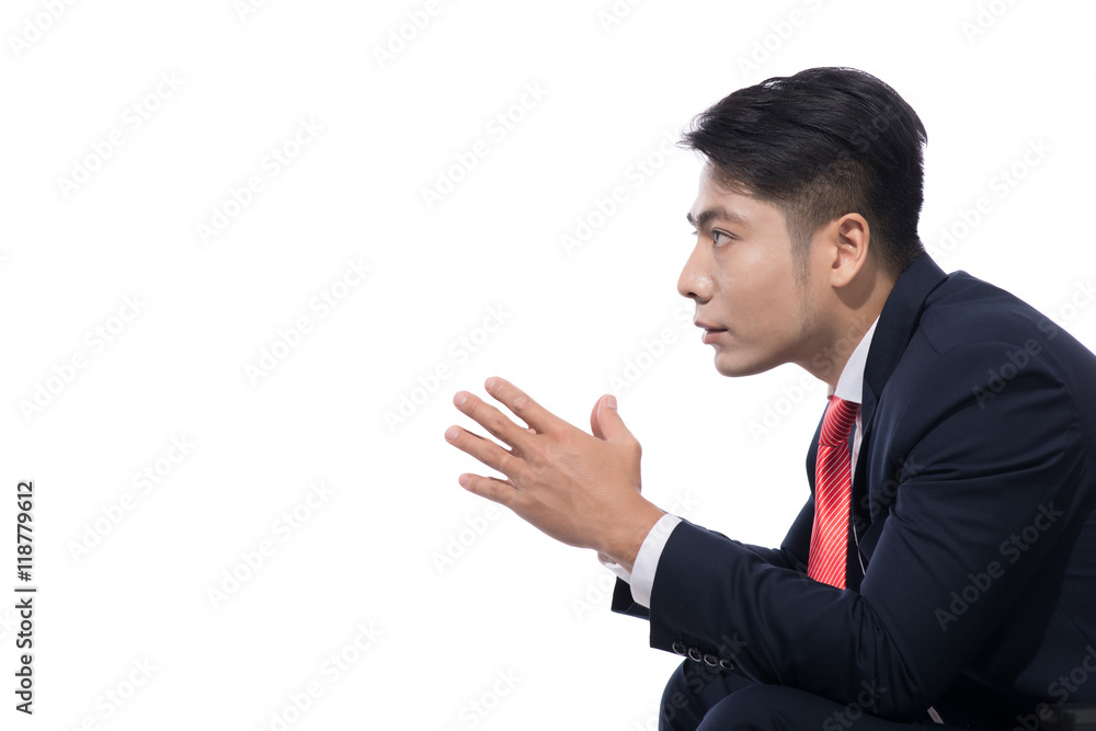 Young businessman sitting on chair over white background, lookin Young businessman sitting on chair over white background, lookin