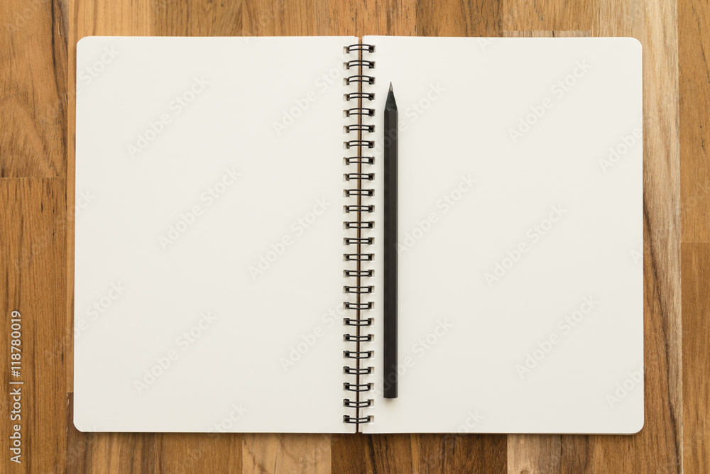 Blank empty notepad and pencil on wooden table background - Business and education concept. Blank empty notepad and pencil on wooden table background - Business and education concept.