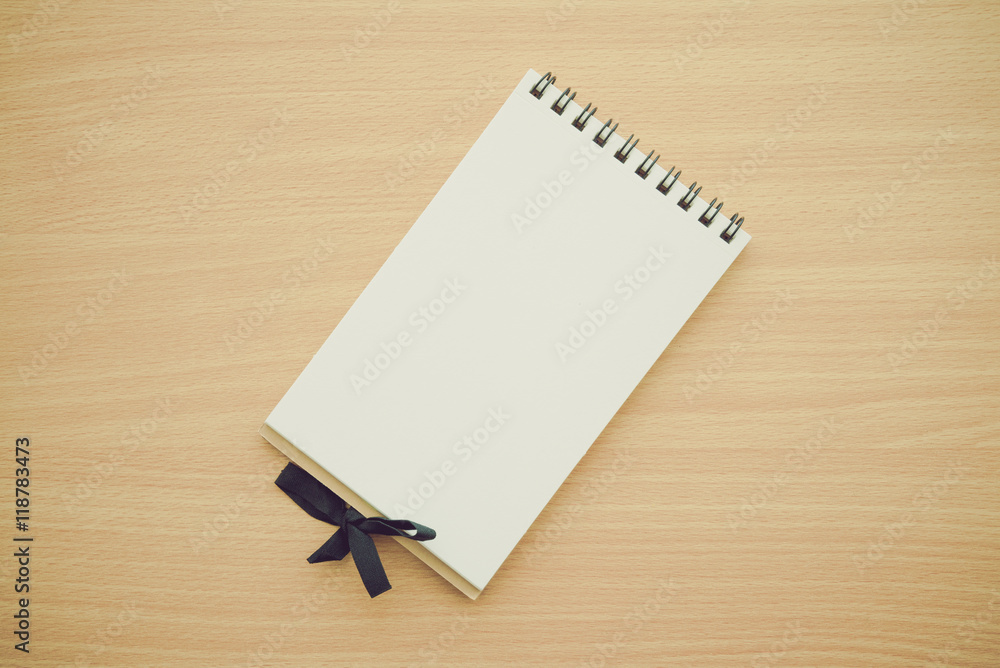 Blank empty notepad on wooden table background - Business and education concept. Blank empty notepad on wooden table background - Business and education concept.