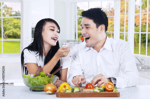 Couple eating salad together