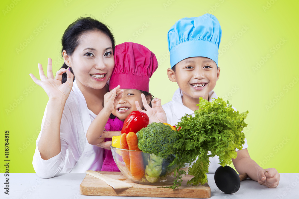 Happy family preparing healthy food Happy family preparing healthy food