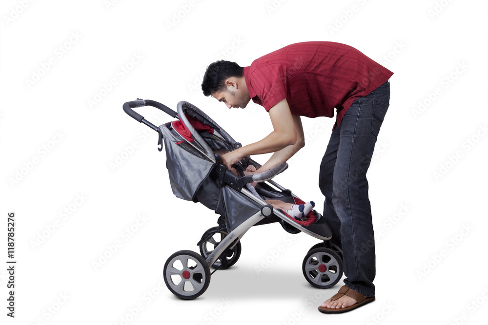 Man and his son inside a stroller Man and his son inside a stroller