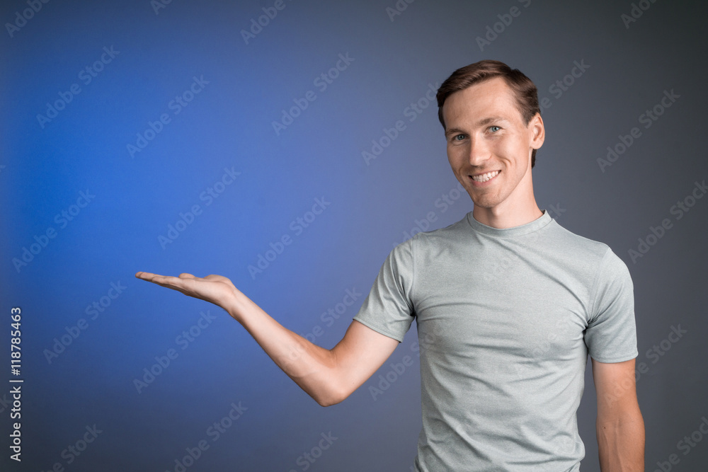 Man holding something on his palm. Man holding something on his palm.