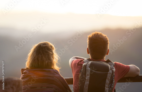 Couple Watching Sunset Mountain Outdoors Concept