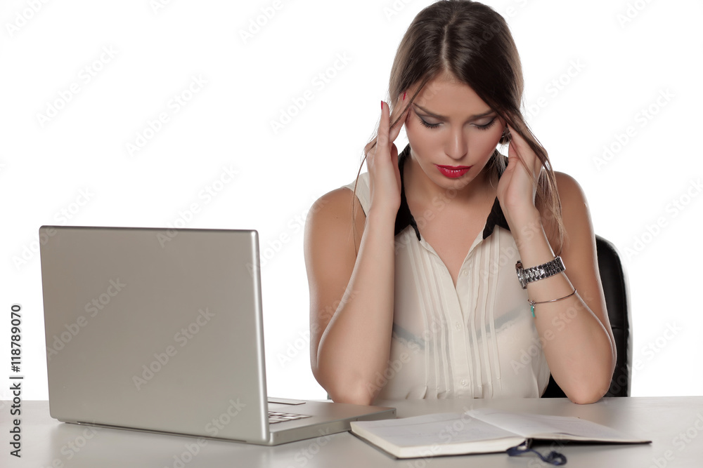 Young beautiful woman with laptop and notebook have a headache Young beautiful woman with laptop and notebook have a headache