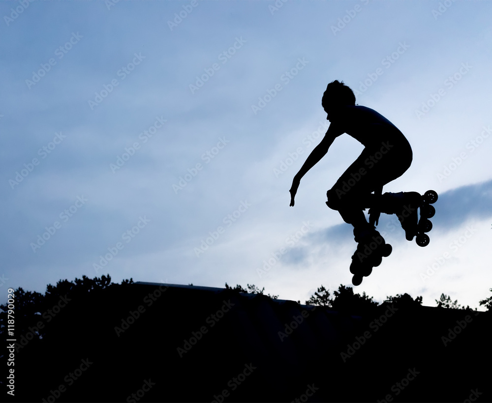 silhouette of a skater in a jump against the blue sky silhouette of a skater in a jump against the blue sky