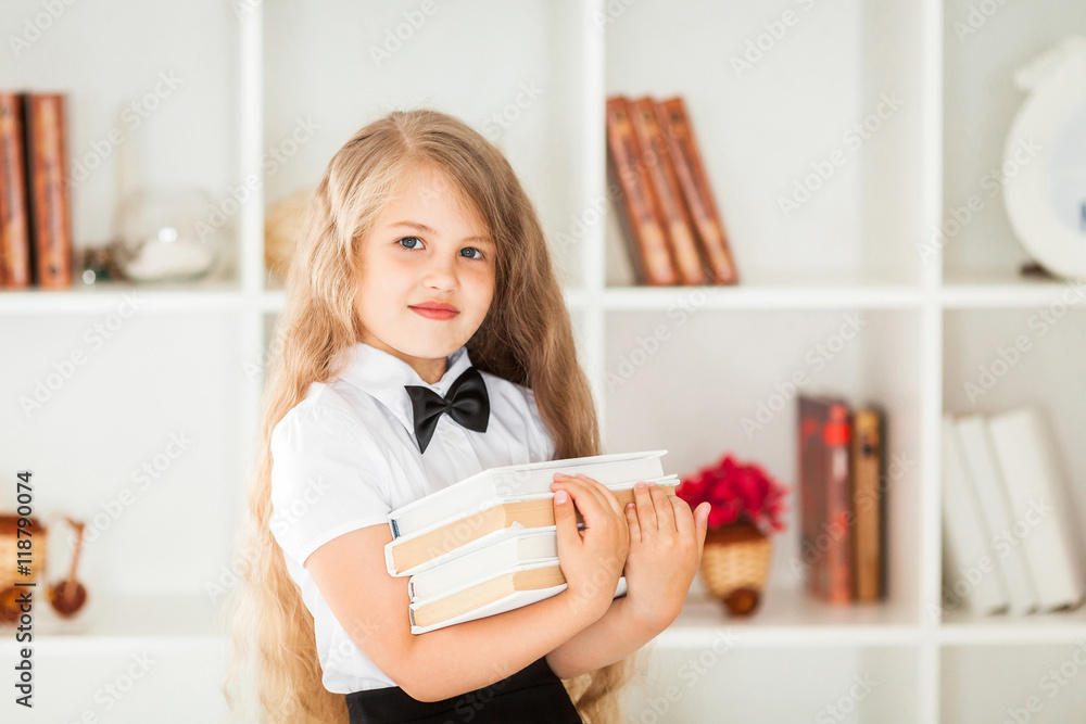 little schoolgirl in school uniform carrying textbooks little schoolgirl in school uniform carrying textbooks