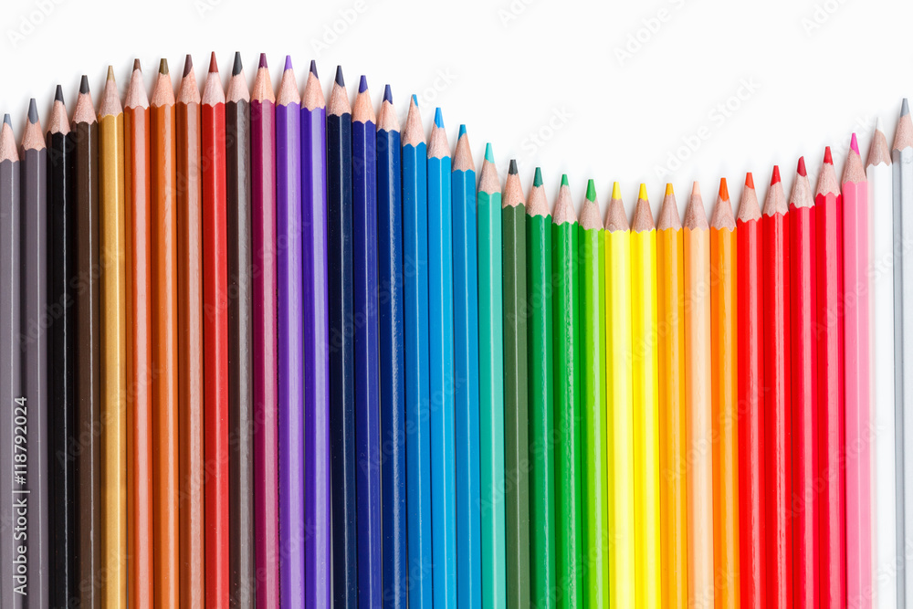 Education concept. Colored pencils on white Education concept. Colored pencils on white