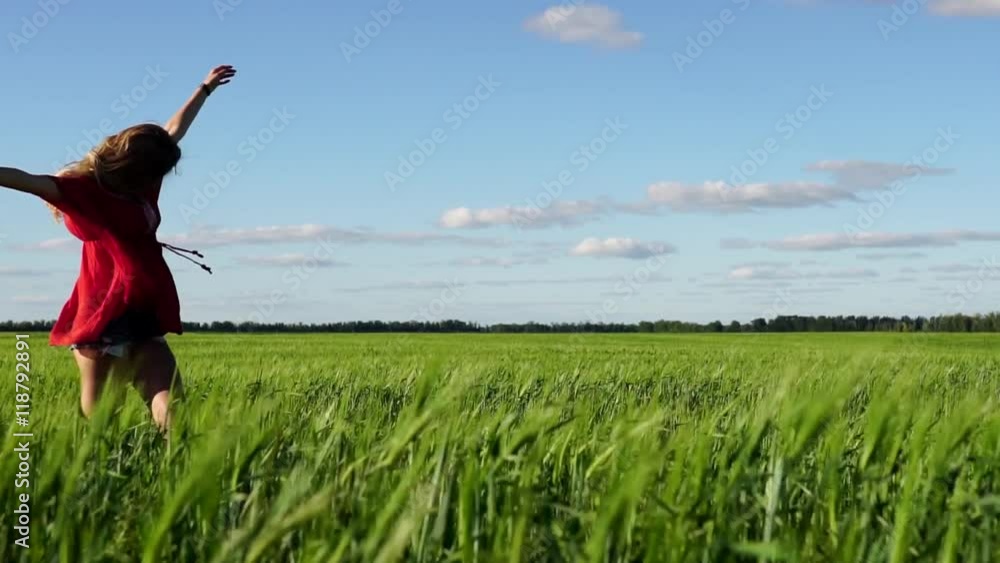 Happy woman enjoying nature beautiful blonde dancing on the field. Freedom concept. Happy woman enjoying nature beautiful blonde dancing on the field. Freedom concept.