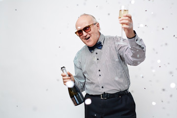 Senior Man Celebrating with Sparkling Wine