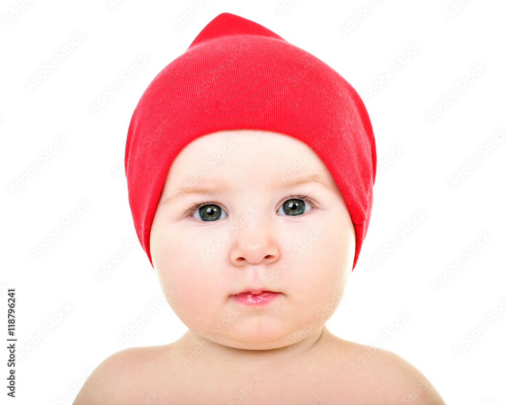 Beautiful happy baby in red hat. . One,isolated on white.