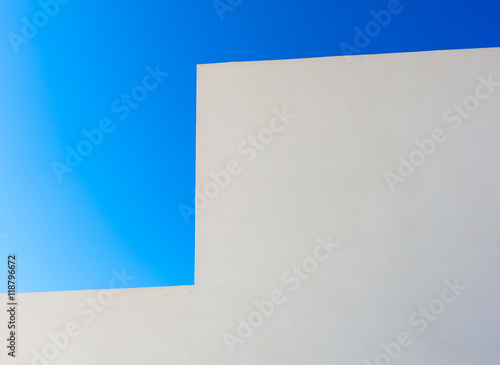 Abstract white wall and blue sky