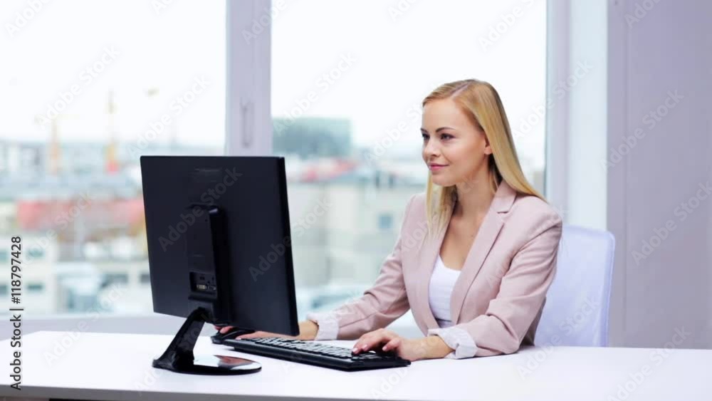 young businesswoman with computer typing at office young businesswoman with computer typing at office