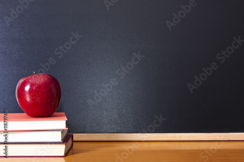 Obraz na plátně books with apple and pen on the desk