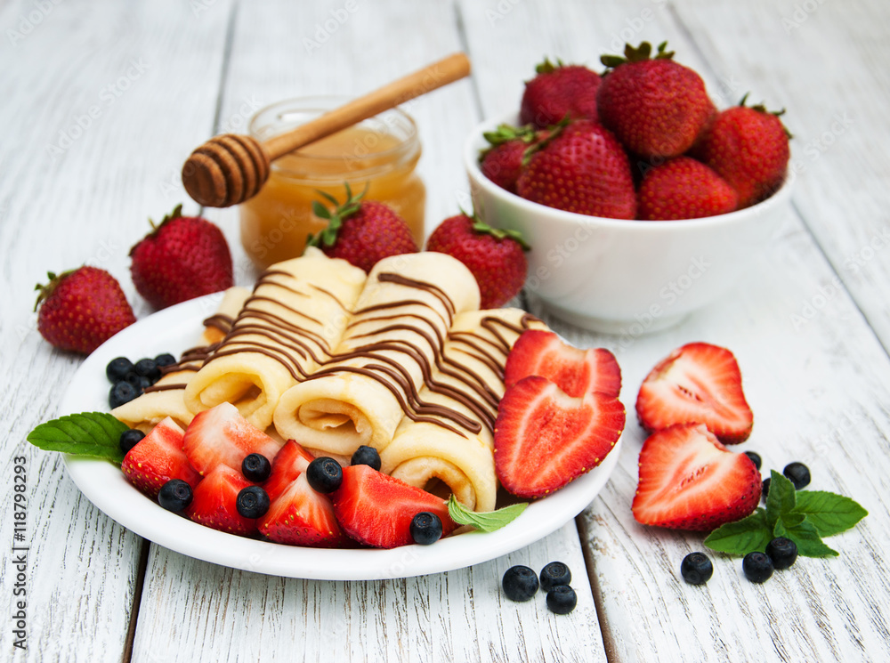 crepes with strawberries and chocolate sauce crepes with strawberries and chocolate sauce