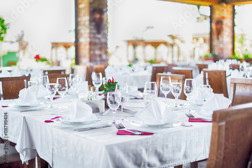 Glasses and plates on table in restaurant