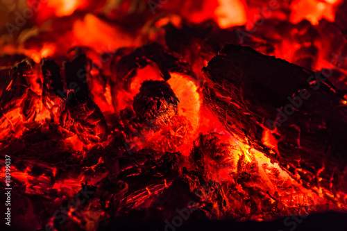 Glowing embers in hot red color. Embers closeup. Embers after a fire. 