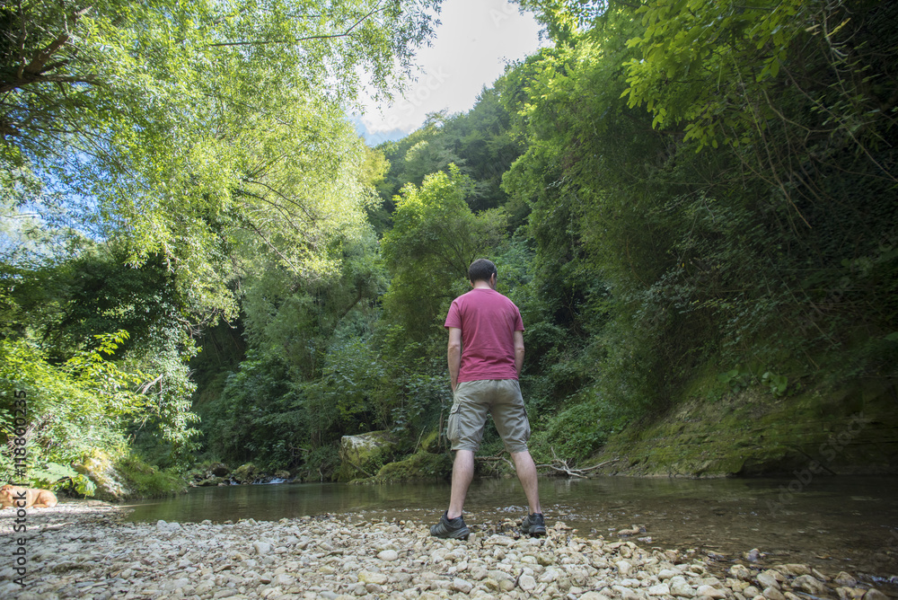 Man on the river, trekking, mountain Man on the river, trekking, mountain